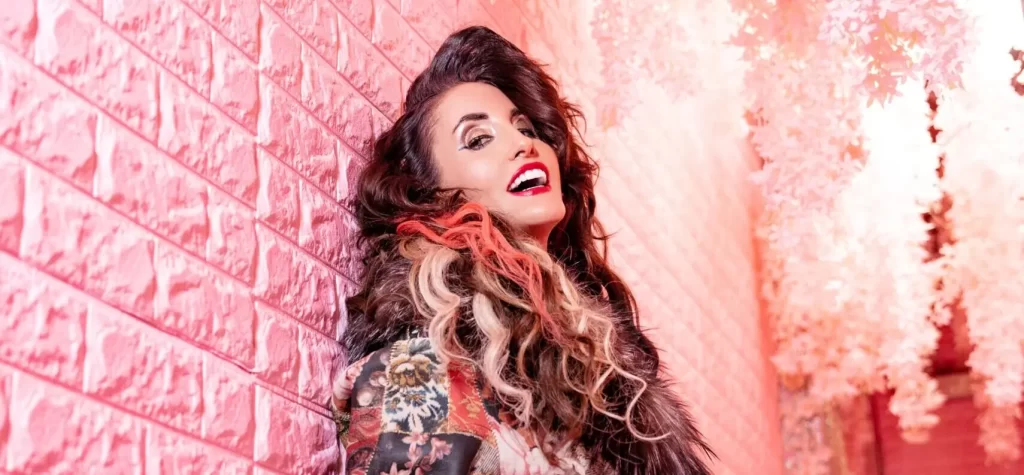 Laura Bryna On Performing At The 2025 CMA Fest And Newest Single “Blue Jean Crazy”